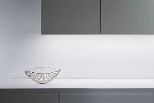 Modern kitchen setup with a white countertop and gray cabinets and wiz lightstrip