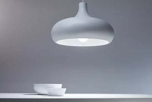 White pendant light fixture on a gray background
