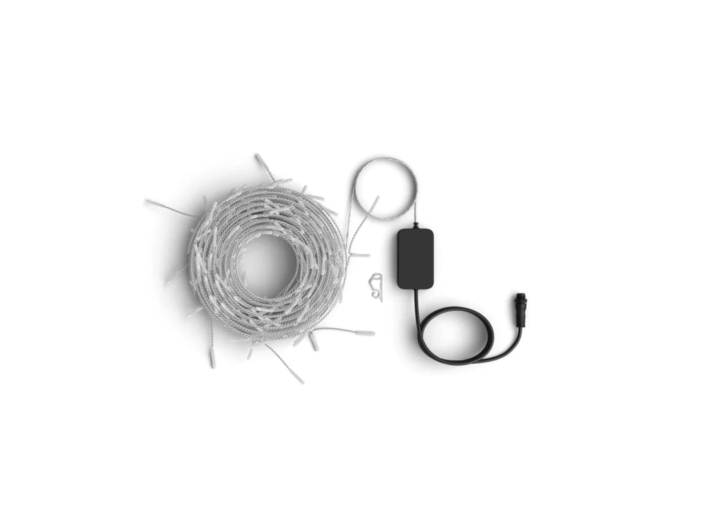 Coiled white string lights with a black power adapter and cable on a plain white background.