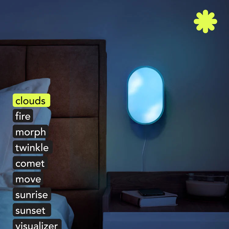 Smart night light on a wall in a bedroom with text options displayed.