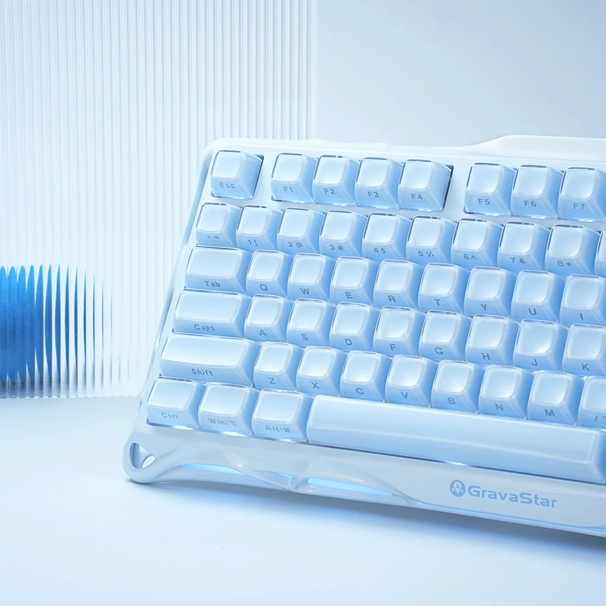 Light blue keyboard with 'GravaStar' branding on a white background