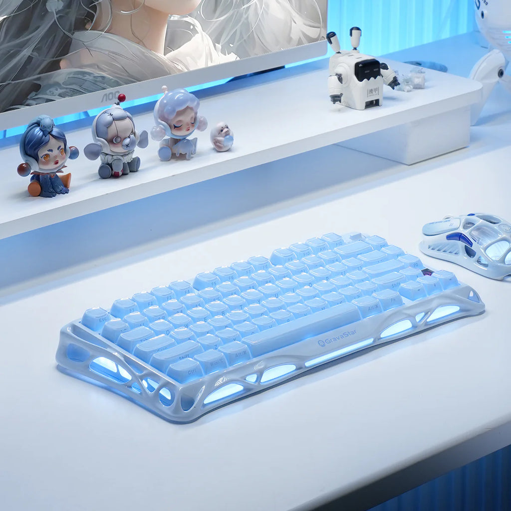 Blue mechanical keyboard on a white surface with decorative items in the background