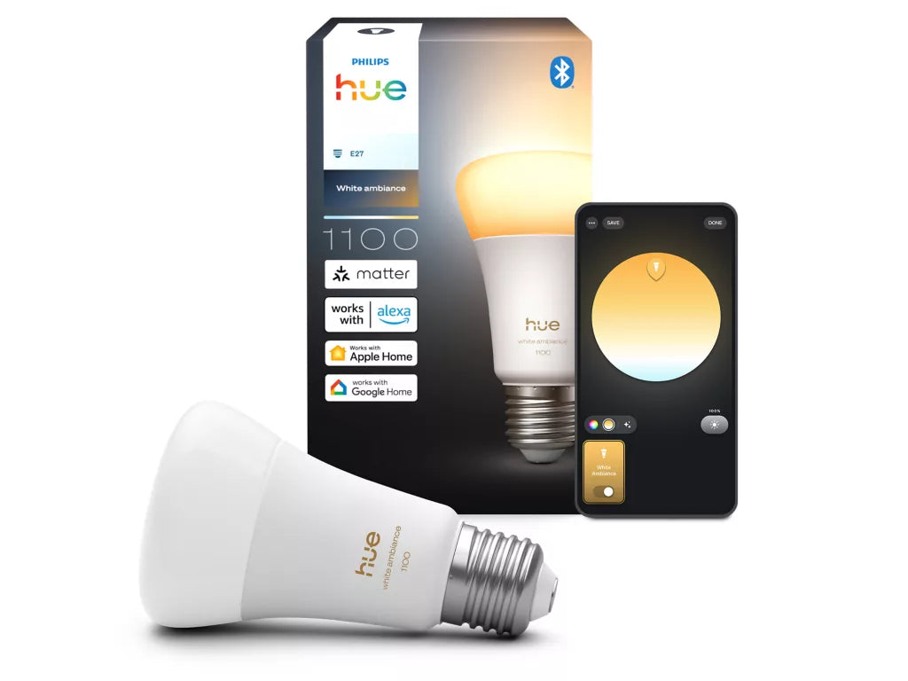 Philips Hue smart light bulb with packaging and smartphone app on a white background