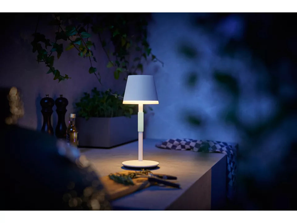 Philips Hue Go Portable Table Lamp on table