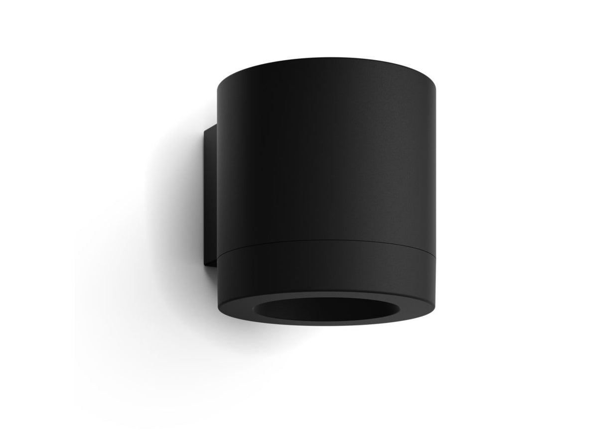 Philips Hue Muscari wall spotlight switched off, showing the round black aluminium shade on its square wall mount.