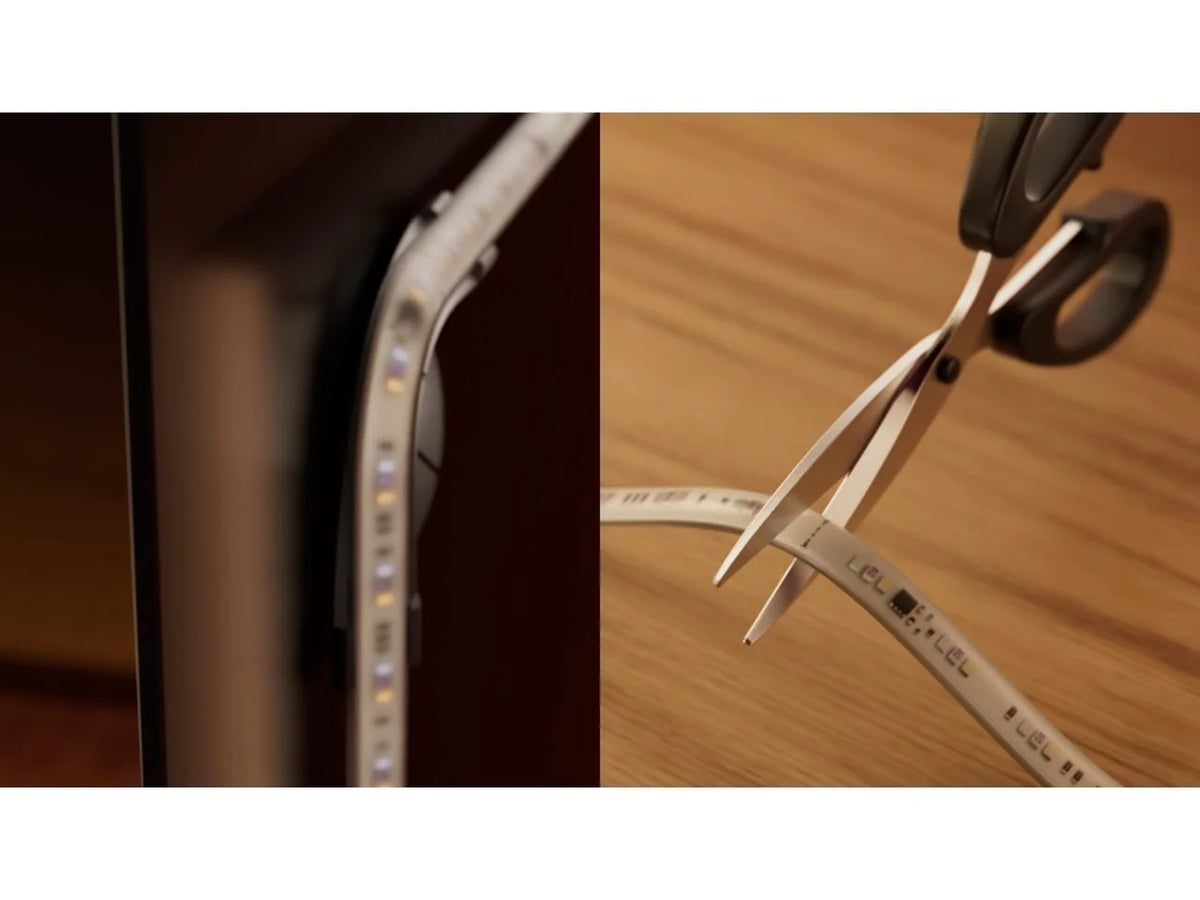 Philips Hue Play Gradient Light Strip Bracket Set holding the strip on the back of a TV
