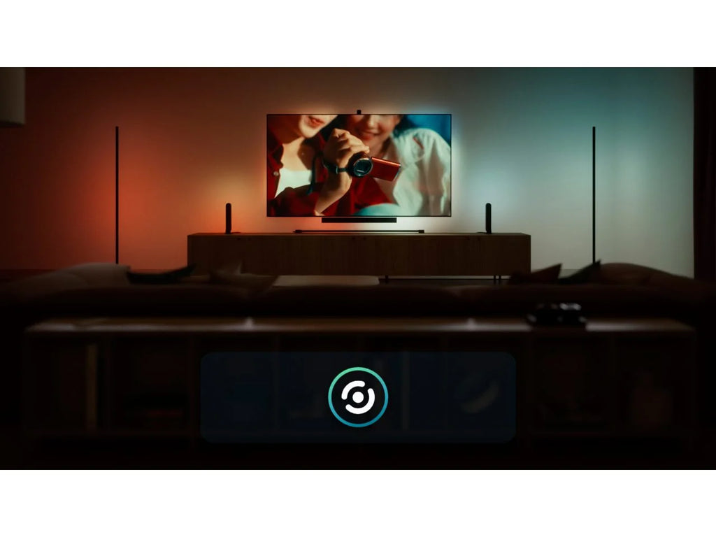 Philips Hue Play Gradient Light Strip syncing with the picture on screen, with warm red light on one side of the TV and cool blue light on the other.