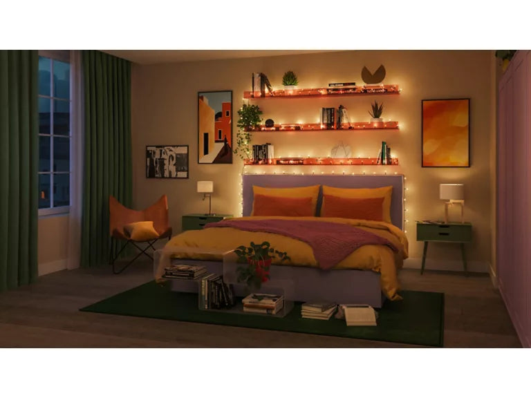 Cozy bedroom with a bed, nightstands, and wiz fairy lights creating a warm ambiance.