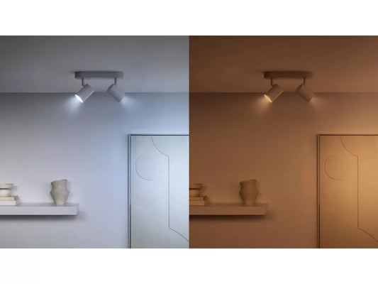 Ceiling light fixture in two different color temperature settings on a wall.