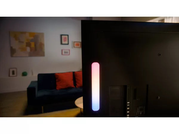 Living room with a TV displaying a colorful bar on the screen wiz gradients