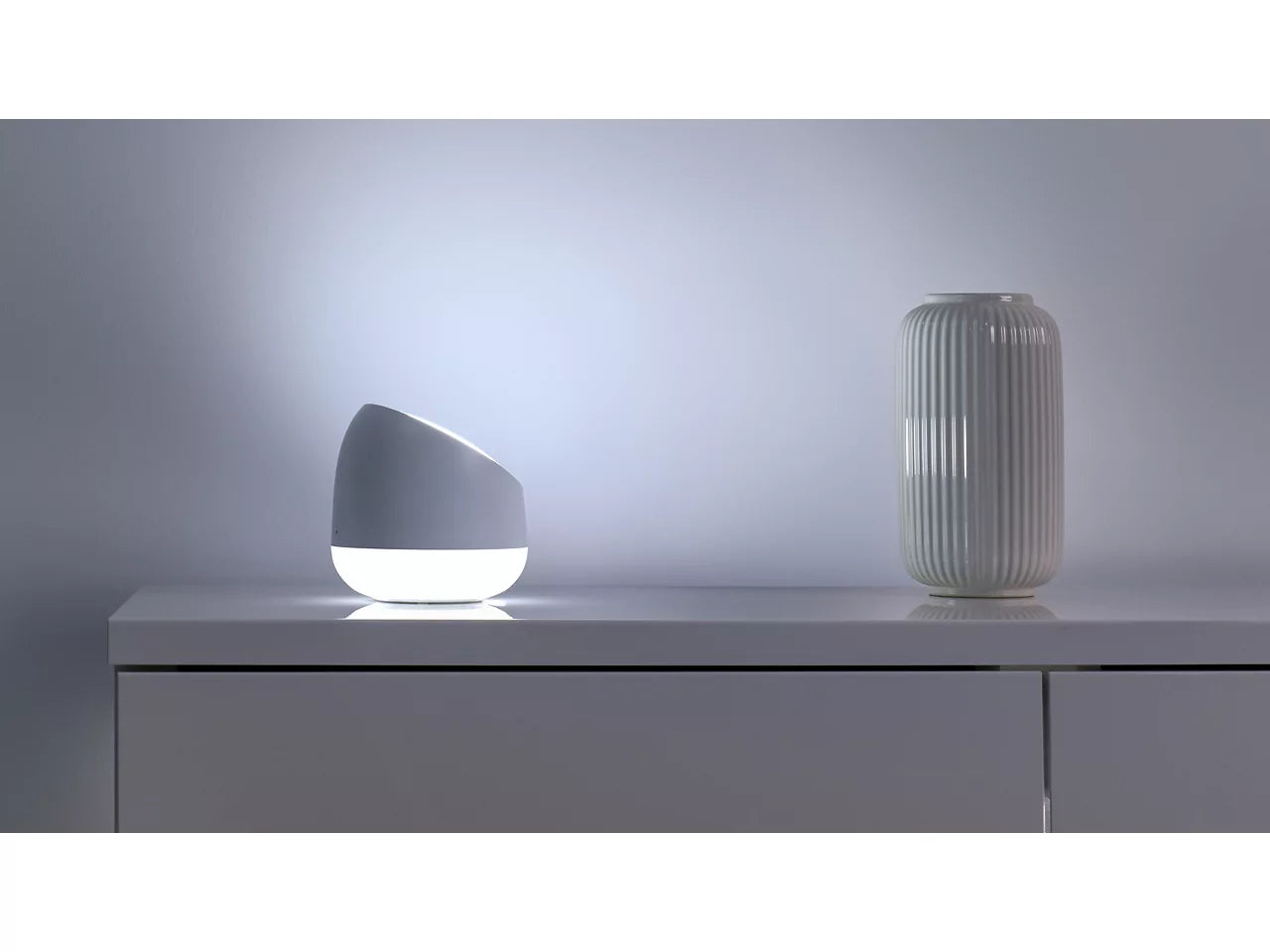 Wiz Squire Modern lamp and vase on a gray surface with a neutral background