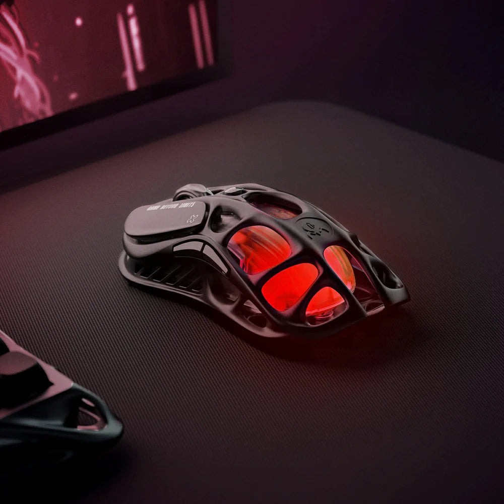 Gaming mouse with red interior lights on a dark surface