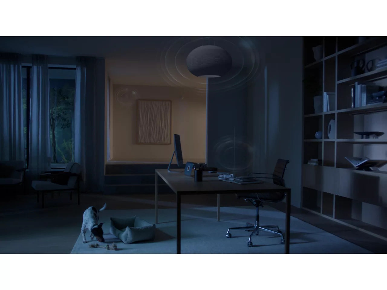 Dark room with a desk, chair, and shelves in a home office setting.