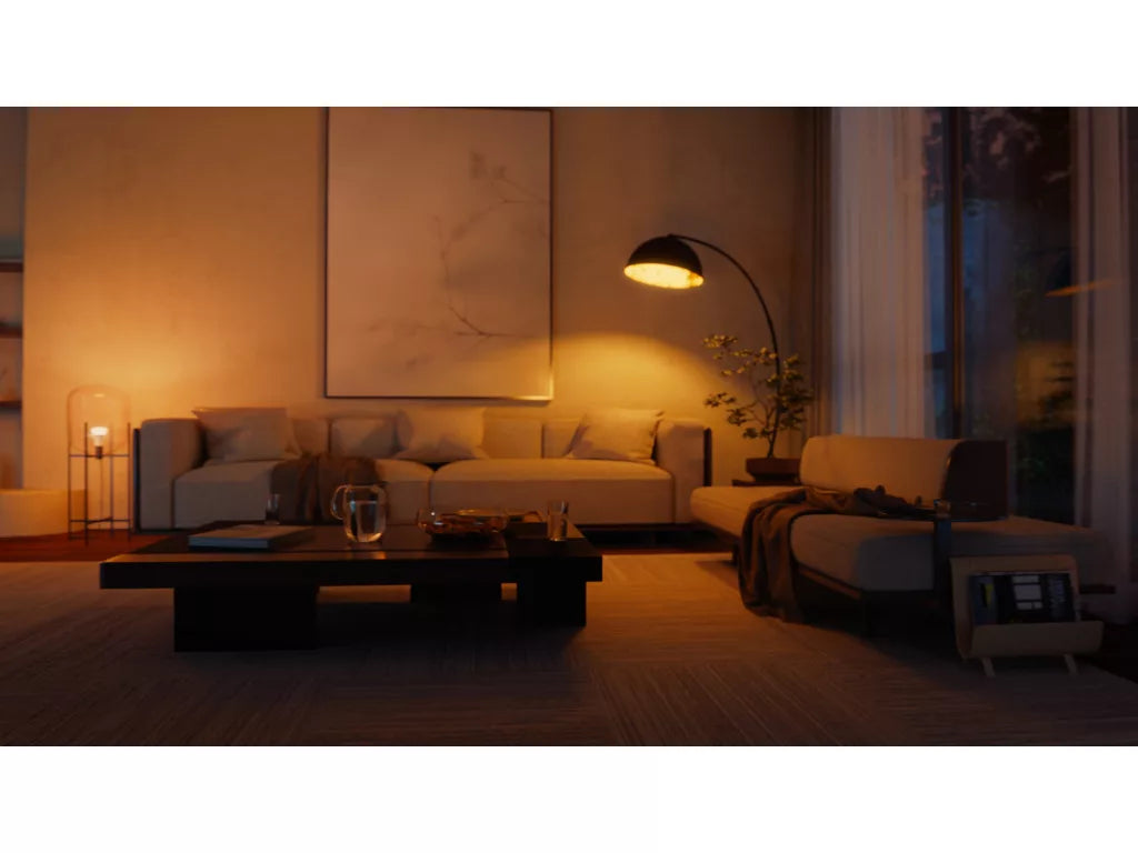 Cozy living room with warm lighting, sofa, coffee table, and decorative elements.