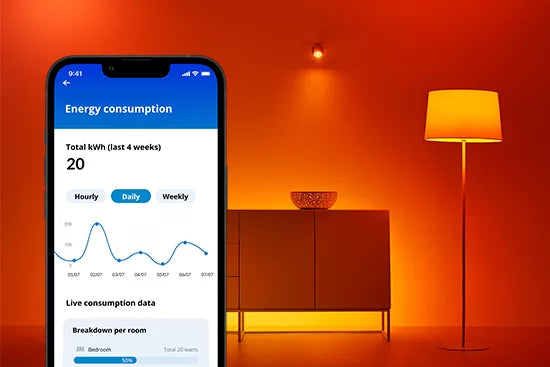 Smartphone displaying energy consumption app with a warm interior setting