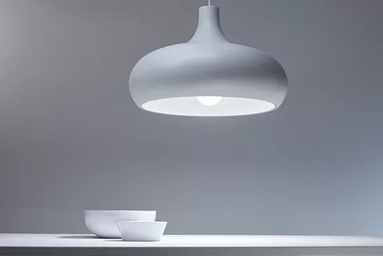 White pendant light fixture on a gray background