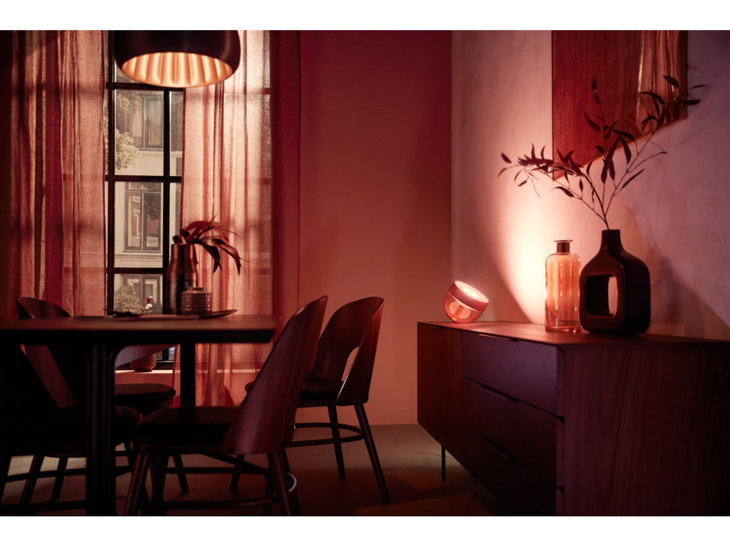 Philips Hue Iris Table Lamp - Copper Special Edition on the counter